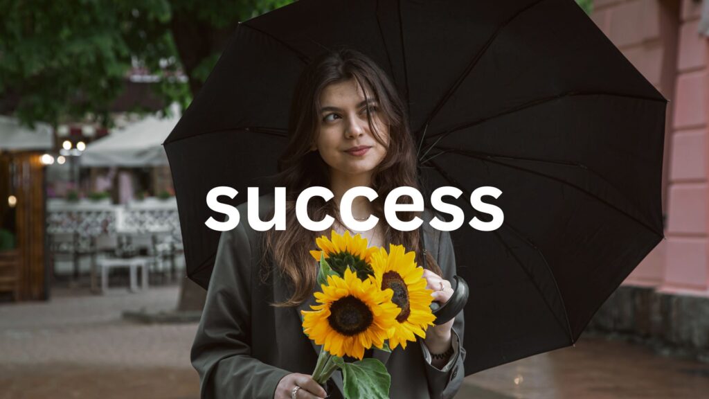 A young woman with a bouquet of sunflowers under an umbrella in rainy weather